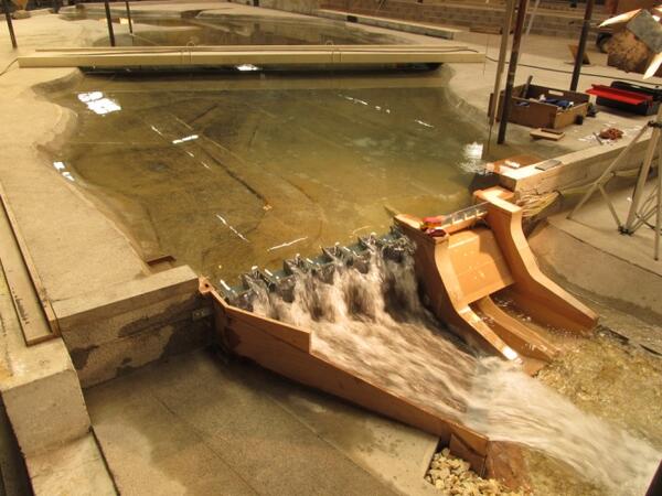 Scale model of reservoir and dam with additional spillway