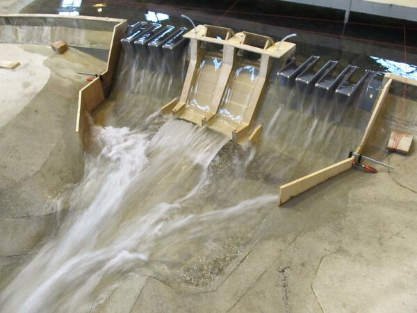 Development of piano-key weirs on the existing spillway at the Charmine dam (France, 01) | Artelia